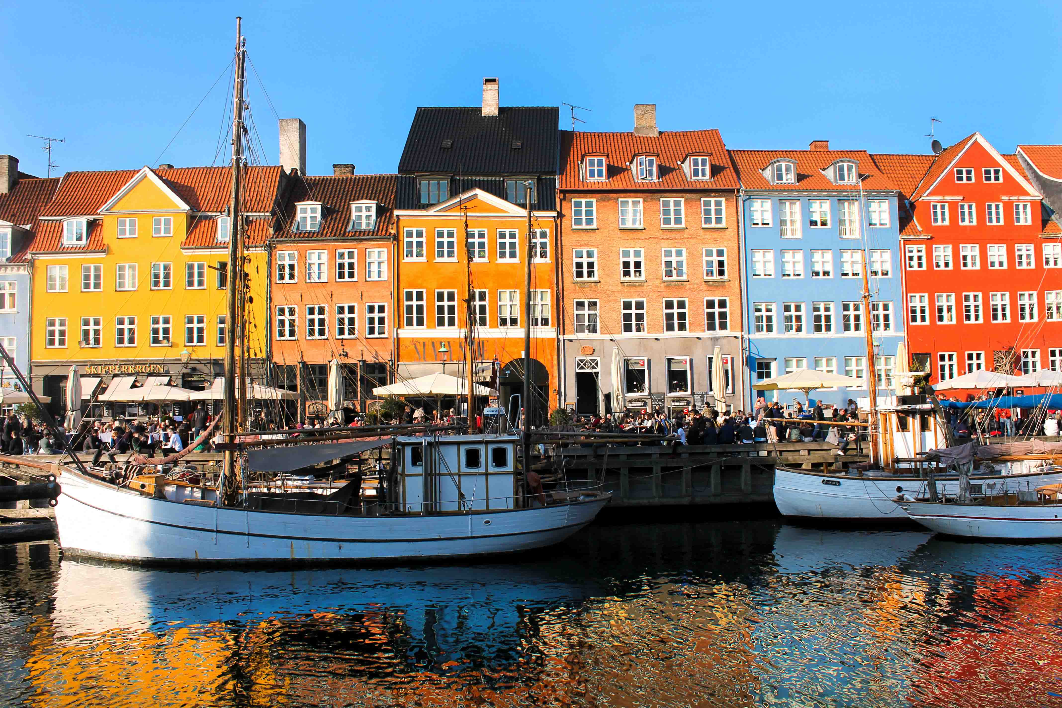 Nyhavn seen from the waterfront. Lovely autumn sunlight hitting the colourful buildings