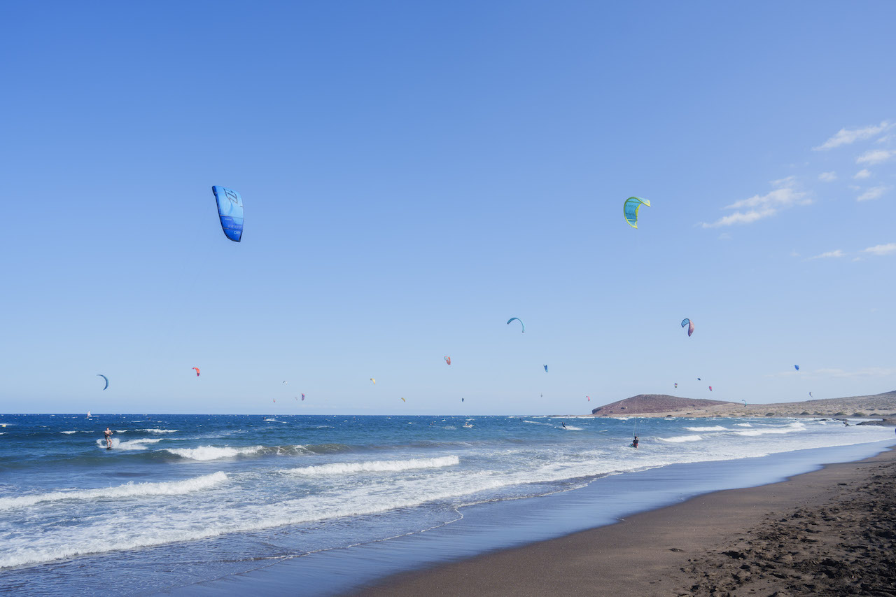 Kites in the sky on a long beach
