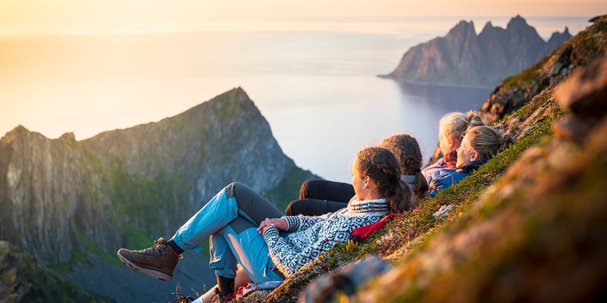 Women enjoying the sunset view on a mountain top