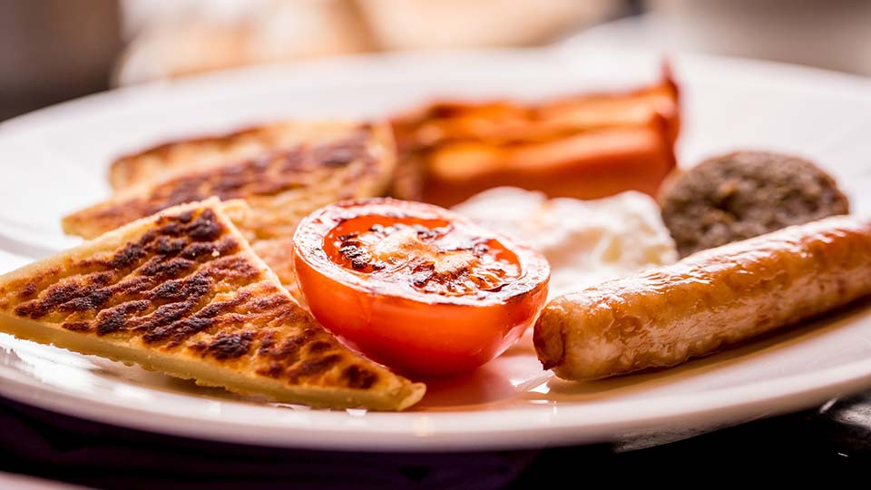 Fly to Belfast, try an Ulster Fry for breakfast.