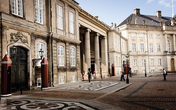 Fly to Copenhagen, see Amalienborg Castle.