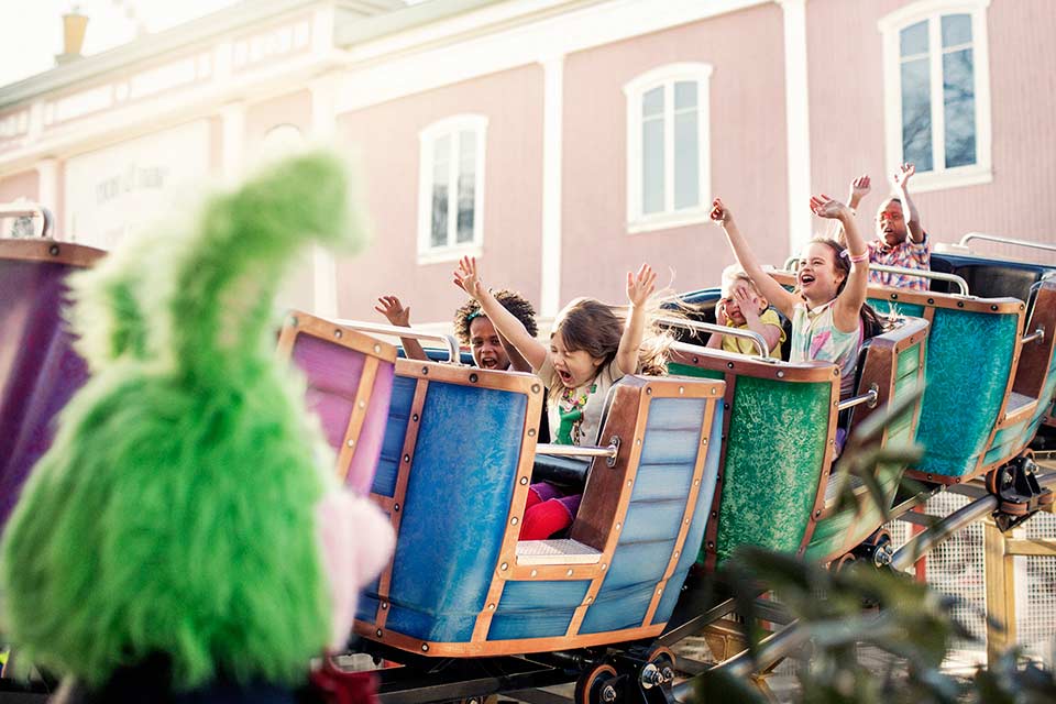 Fly to Gothenburg, visit amusement park Liseberg.
